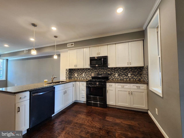 2636 Quantico Ave, Baltimore, MD 21215 - kitchen with a peninsula, dishwashing machine, black range with gas stovetop, a sink, and visible vents