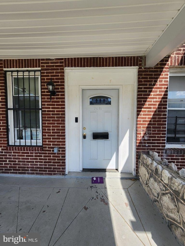 2636 Quantico Ave, Baltimore, MD 21215 - view of exterior entry featuring a porch and brick siding