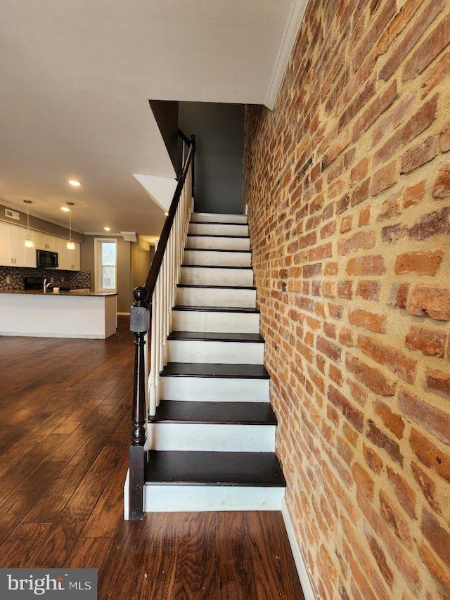 2636 Quantico Ave, Baltimore, MD 21215 - staircase featuring wood-type flooring and recessed lighting