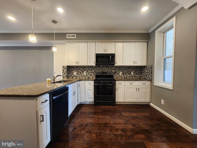2636 Quantico Ave, Baltimore, MD 21215 - kitchen with visible vents, a peninsula, crown molding, backsplash, and black appliances