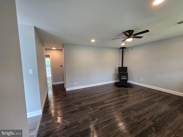 1079 Notley Ct, Pasadena, MD 21122 - unfurnished living room featuring dark wood finished floors, recessed lighting, baseboards, a ceiling fan, and a wood stove