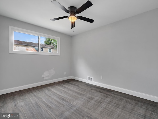 1079 Notley Ct, Pasadena, MD 21122 - spare room with baseboards, ceiling fan, and dark wood-style flooring