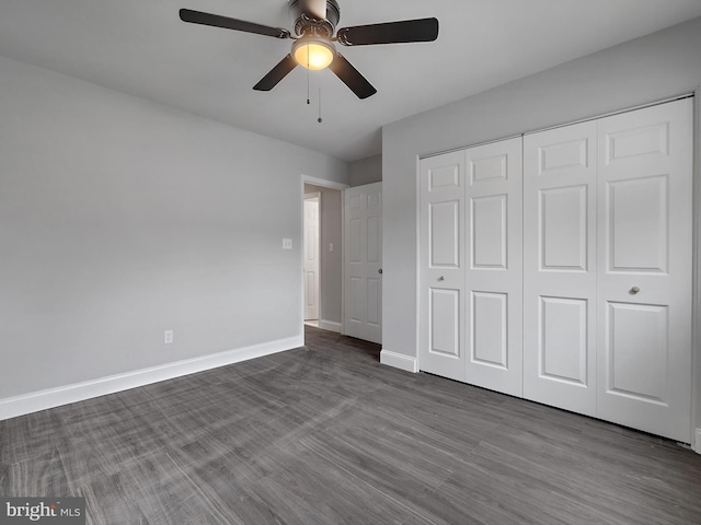 1079 Notley Ct, Pasadena, MD 21122 - unfurnished bedroom featuring baseboards, a closet, dark wood-style floors, and ceiling fan