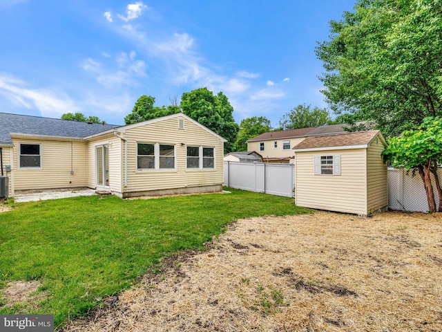 1079 Notley Ct, Pasadena, MD 21122 - rear view of house with central AC and roof with shingles