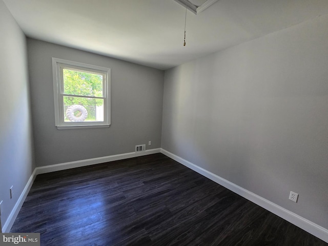 1079 Notley Ct, Pasadena, MD 21122 - empty room with dark wood finished floors and baseboards