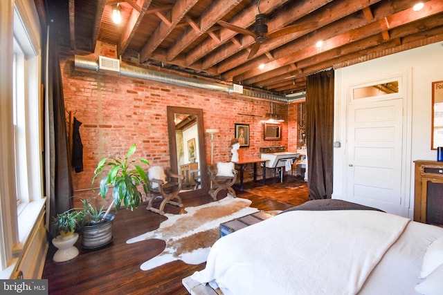 1830 Columbia Rd NW, Washington, DC 20009 - bedroom featuring visible vents, wood finished floors, and brick wall