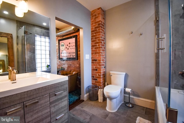 1830 Columbia Rd NW, Washington, DC 20009 - full bath featuring a shower with shower door, toilet, tile patterned floors, and baseboards