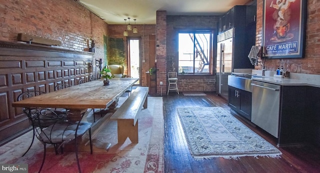 1830 Columbia Rd NW, Washington, DC 20009 - dining space featuring brick wall and hardwood / wood-style floors