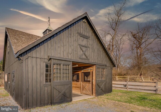 view of outbuilding featuring an outdoor structure and an exterior structure