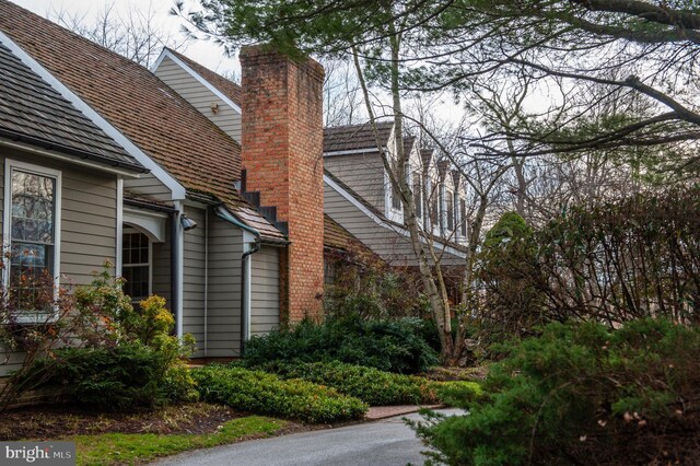 view of side of property featuring a chimney