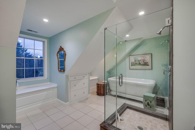 full bath with a freestanding tub, a shower stall, tile patterned floors, vaulted ceiling, and recessed lighting