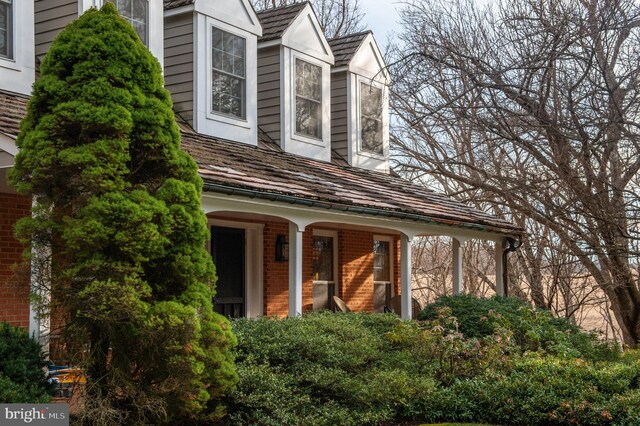view of property exterior featuring a porch