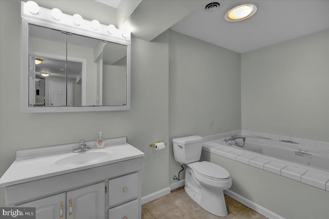 full bathroom with toilet, vanity, a bath, baseboards, and tile patterned floors