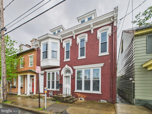 view of front of house with brick siding