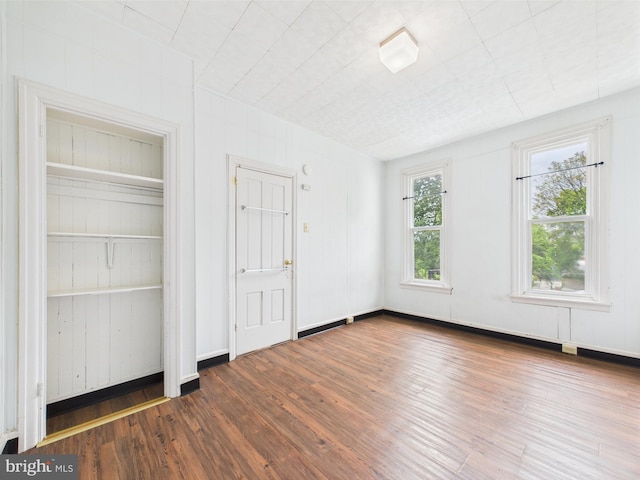 unfurnished bedroom featuring wood finished floors