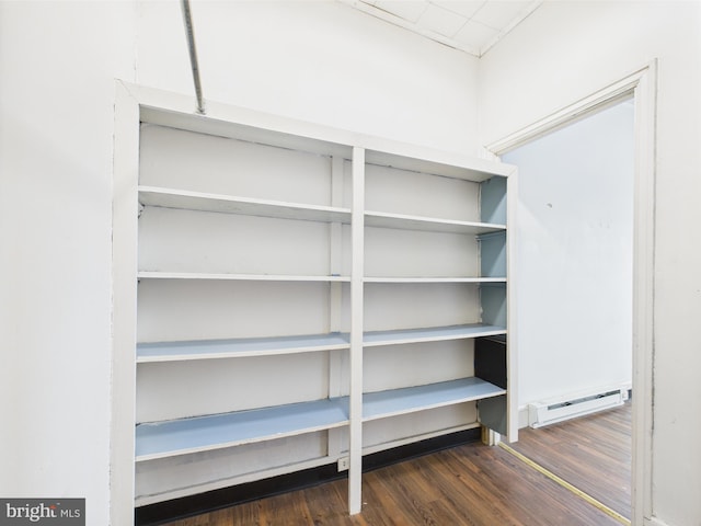 pantry featuring a baseboard heating unit