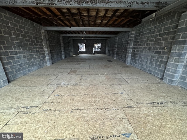 interior space featuring concrete block wall
