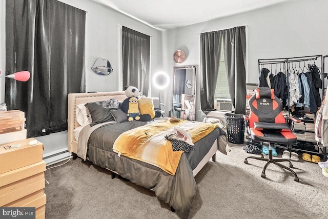 carpeted bedroom featuring baseboard heating
