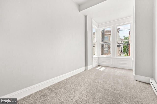 empty room with baseboards and carpet floors