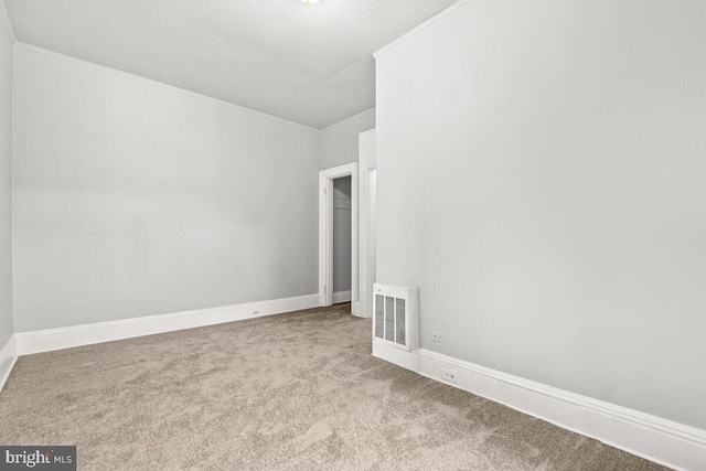 unfurnished room with carpet floors, baseboards, and visible vents