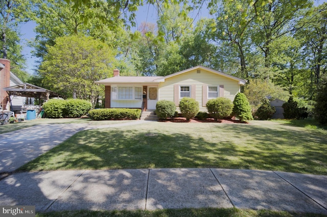 view of front of house with a front lawn, a porch, and a chimney