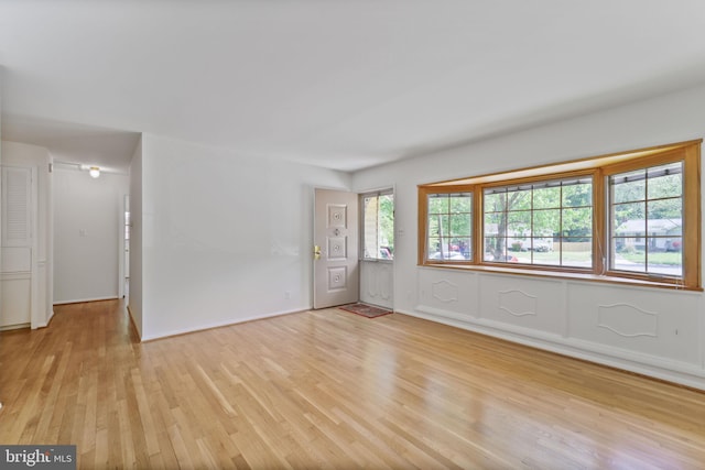 empty room featuring light wood-style floors and baseboards