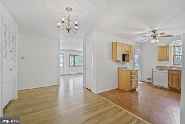 kitchen featuring dishwasher, a chandelier, plenty of natural light, and light wood-style flooring