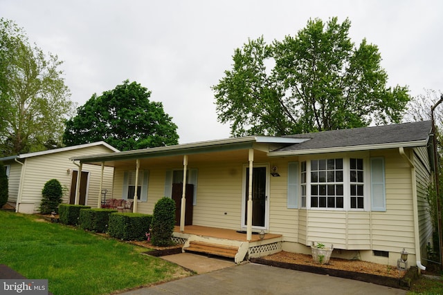 ranch-style house with a porch, a front lawn, and crawl space