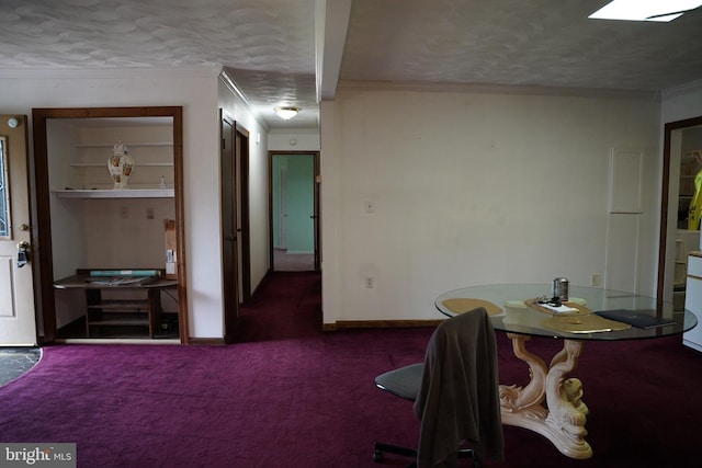 dining room featuring a textured ceiling, crown molding, and carpet floors