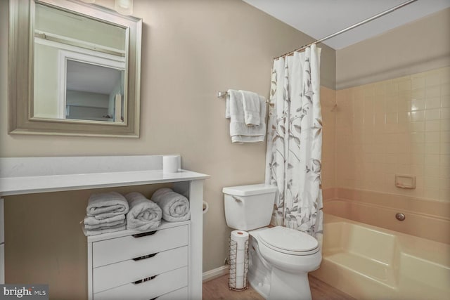 full bath featuring toilet, wood finished floors, and shower / bath combo