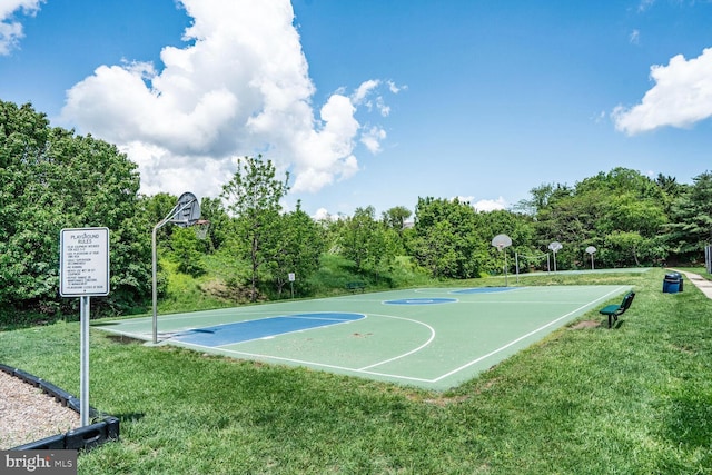 view of sport court with community basketball court and a lawn