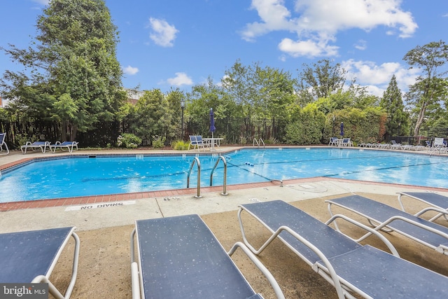 4829 27th Rd S, Arlington, VA 22206 - community pool featuring fence, view of scattered trees, and a patio area