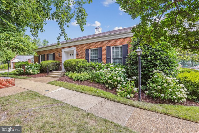 4829 27th Rd S, Arlington, VA 22206 - view of front of house with brick siding and a chimney