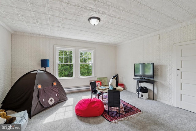 carpeted living room featuring a baseboard heating unit, an ornate ceiling, and ornamental molding