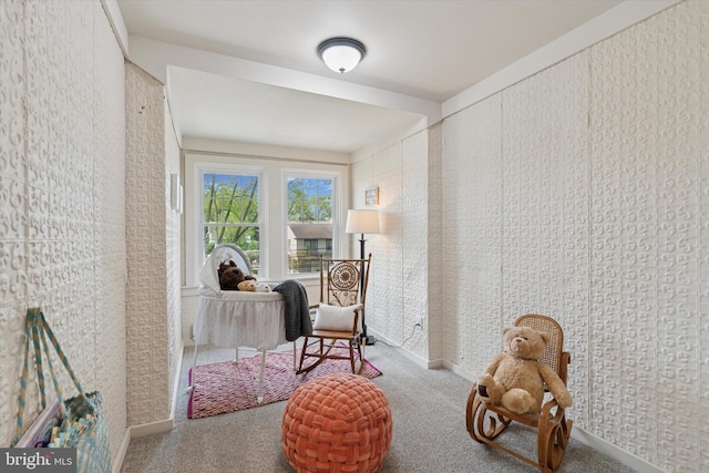 sitting room with carpet flooring