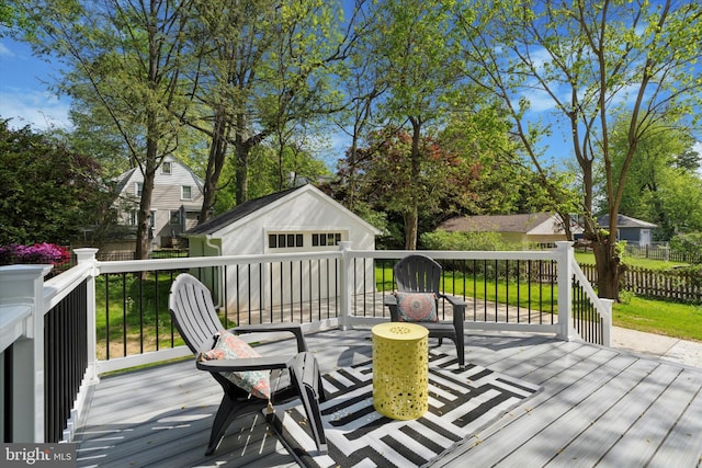 wooden deck with an outdoor structure and fence
