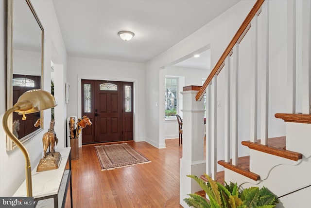 entrance foyer with light wood-type flooring and baseboards