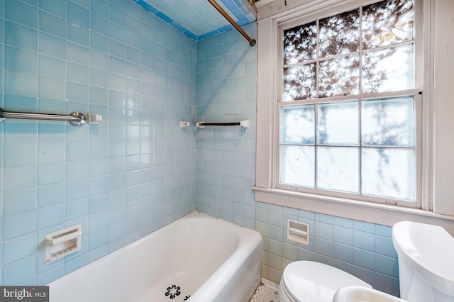 full bath featuring toilet, a bath, tile walls, and a shower
