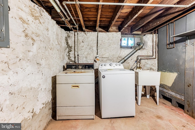 laundry room with washer and clothes dryer and electric panel