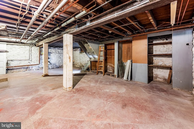 unfinished basement with stairs