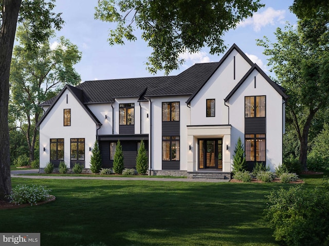 modern farmhouse style home with stucco siding and a front yard