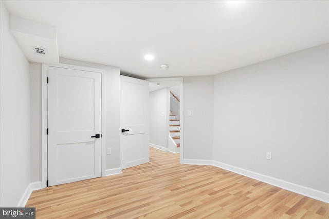 2312 Edmondson Ave, Baltimore, MD 21223 - finished basement featuring light wood-style flooring, baseboards, stairs, and recessed lighting