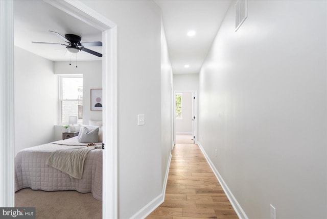 2312 Edmondson Ave, Baltimore, MD 21223 - hallway featuring light wood-type flooring, plenty of natural light, recessed lighting, and baseboards