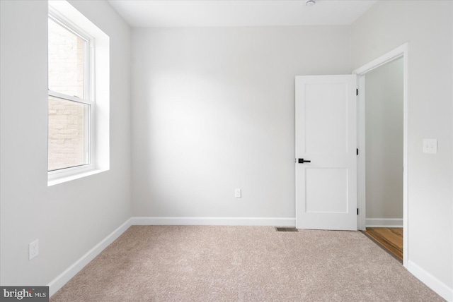 2312 Edmondson Ave, Baltimore, MD 21223 - empty room with carpet floors and baseboards