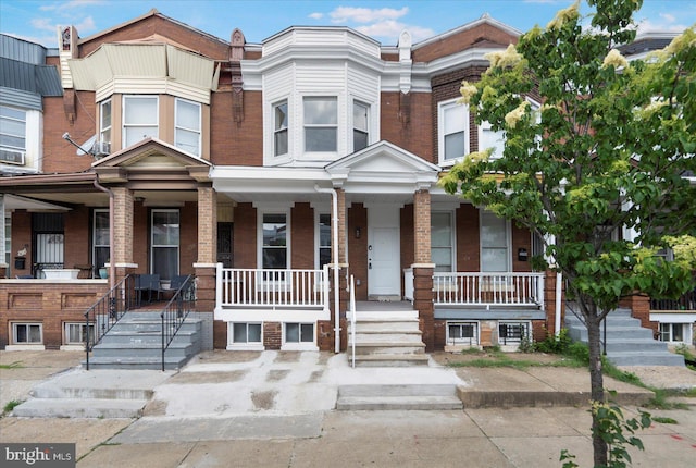 2312 Edmondson Ave, Baltimore, MD 21223 - view of property with brick siding and covered porch