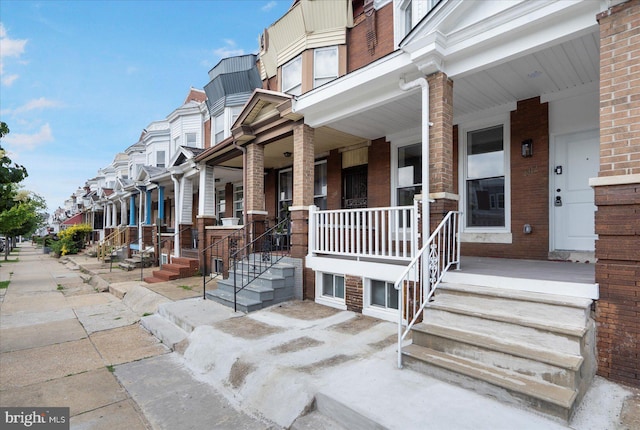2312 Edmondson Ave, Baltimore, MD 21223 - property entrance with brick siding, covered porch, and a residential view
