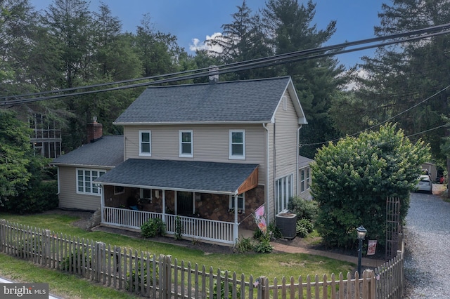 1501 Long Corner Rd, Mount Airy, MD 21771 - view of front of home with a porch, central AC, a shingled roof, and a fenced front yard