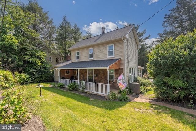 1501 Long Corner Rd, Mount Airy, MD 21771 - view of front of property featuring covered porch, a chimney, a front yard, cooling unit, and stone siding