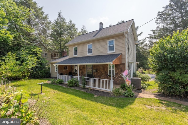 1501 Long Corner Rd, Mount Airy, MD 21771 - rear view of house featuring a porch, a chimney, a lawn, central AC, and stone siding