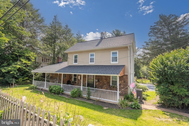 1501 Long Corner Rd, Mount Airy, MD 21771 - farmhouse-style home featuring covered porch, stone siding, a front yard, and roof with shingles